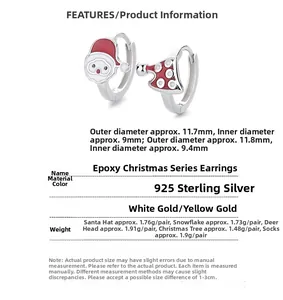 Detail of 925 sterling silver Christmas hoop earrings with enamel Santa and tree charms