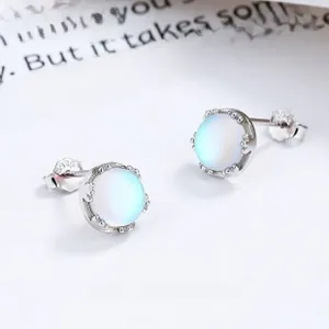 Macro view of S925 sterling silver moonstone stud earrings with crown setting detail