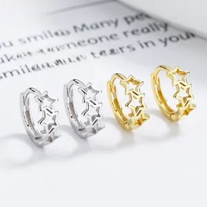 Detailed view of silver and gold plated 925 sterling silver hollow star hoop earrings