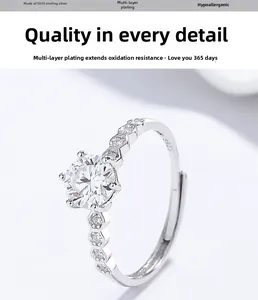Macro detail of S925 sterling silver ring with six-prong moissanite setting and engraving