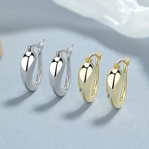 U-shaped drop earrings in silver and gold finishes with polished mirror surface