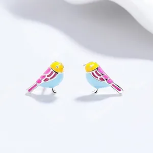 Macro shot of colorful bird stud earrings in 999 sterling silver with enamel dripping oil detail