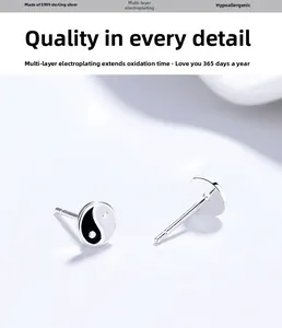 Detail of S999 sterling silver Bagua studs with black and white enamel finish