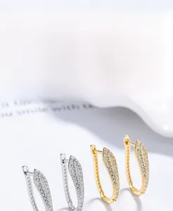 Detail view of S925 sterling silver U-shaped hoop earrings set with cubic zirconia stones