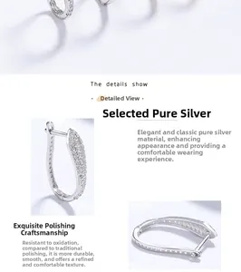 Close-up of 925 silver U-shaped earrings with micro-paved white zircon and polished finish