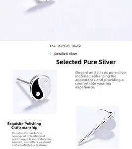 Close-up of S925 sterling silver yin yang stud earrings with polished enamel finish