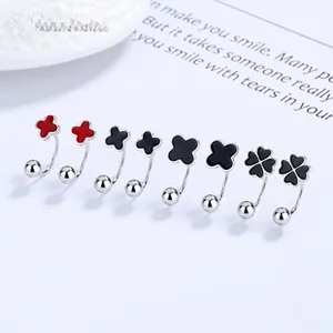 Close-up of S925 silver clover U-shape stud earrings in red and black enamel