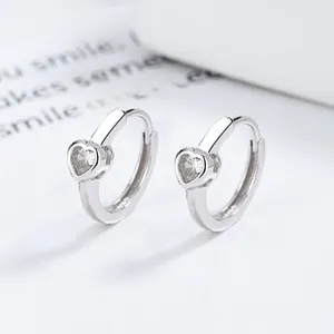 Detail view of 925 sterling silver heart-shaped earrings with clear zircon stones