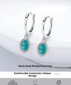 Detailed close-up of 925 silver hoop earrings with oval green marble resin pendants