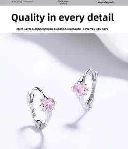 Macro shot of S925 sterling silver pink heart earring with polished finish and engraving
