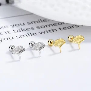 Macro shot of 925 sterling silver ginkgo leaf earrings with fine radial texture details