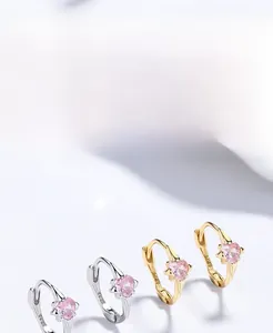 Detail view of pink heart zircon earrings with S925 hallmark in silver and gold plating