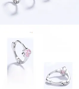 Detail view of 925 sterling silver hoop earrings with pink heart cubic zirconia stones
