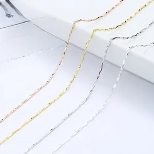 Detailed view of polished twist chain necklaces in rose gold, gold, and silver finishes