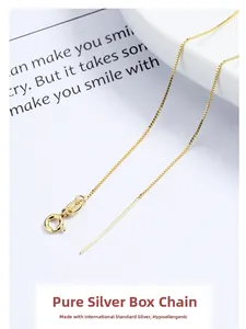 Macro detail of 18k gold plated 925 sterling silver box chain with adjustable needle end