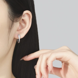 925 silver U-shape hoop earrings with sparkling cubic zirconia on female model