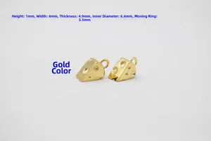 Macro shot of 925 sterling silver cheese charms with gold plating and S925 hallmark