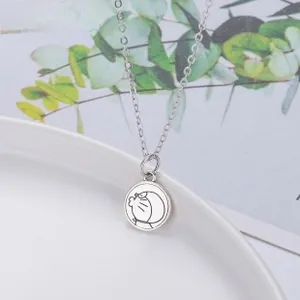 Macro detail of S925 sterling silver necklace featuring a cute cartoon kitten paw design