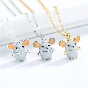 Detailed close-up of cute grey mouse enamel pendants on silver and gold chains
