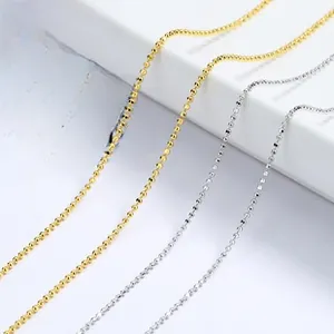 Close-up of S925 sterling silver beaded ball chains in gold and silver finishes