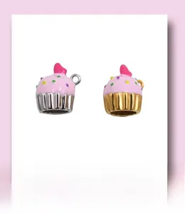 Detailed view of silver and gold cupcake charms with colorful enamel for DIY jewelry