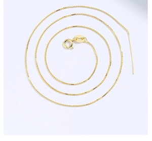 Macro shot of 18k gold plated S925 silver box chain with adjustable needle tip design