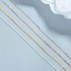 Detail of four colored S925 sterling silver snake chains in gold, silver, and rose gold