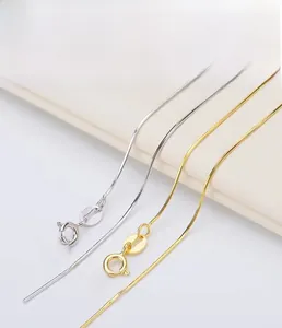 Detailed macro of S925 sterling silver snake chain showing the hallmark and plating