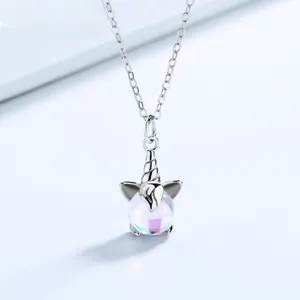 Macro detail of silver unicorn pendant featuring a vibrant iridescent purple glass bead