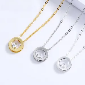 Detailed macro view of S925 silver and gold circle pendants with sparkling white zircons