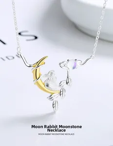 Detailed macro view of S925 silver rabbit and moonstone pendant with gold plating