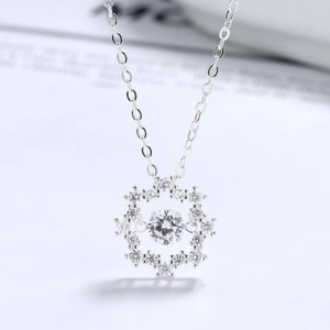 Macro view of snowflake pendant with dancing center zircon on S925 silver chain
