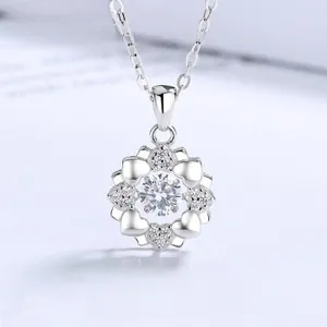 Close-up of S925 silver necklace featuring a dancing stone snowflake and heart pendant