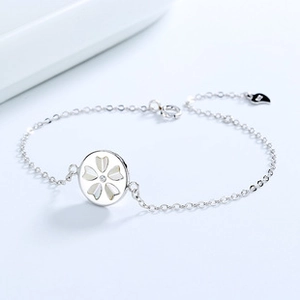 Detailed macro view of S925 sterling silver chain with a floral mother-of-pearl pendant