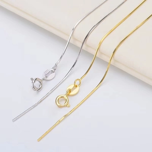 S925 sterling silver snake bone chain necklaces in gold and silver finish on soft fabric