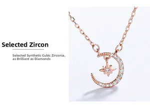 Détail du pendentif étoile et lune en or rose orné de zircons cubiques brillants