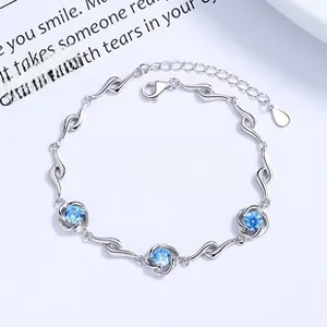 Detailed macro view of 925 silver clover bracelet featuring blue zircon stones