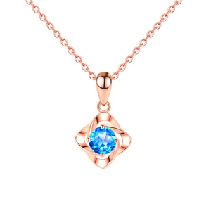 Detail of rose gold clover necklace featuring a brilliant round blue gemstone pendant
