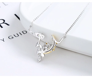Detailed close-up of 925 sterling silver moon rabbit pendant with natural moonstone