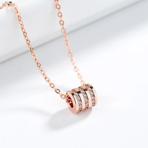 Macro shot of rose gold S925 silver bracelet with sparkling zircon encrusted cylinder