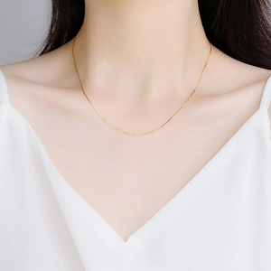 Minimalist S925 sterling silver gold-plated snake chain necklace on female neck