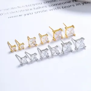 Detailed view of square cubic zirconia stud earrings in multiple sizes and metal finishes