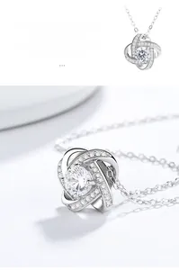 Macro shot of 925 sterling silver four-leaf clover pendant with sparkling cubic zirconia