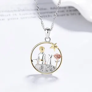 Macro shot of 925 silver The Little Prince pendant with star and rose details