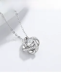 Detail of S925 sterling silver knot pendant with brilliant round-cut cubic zirconia stone