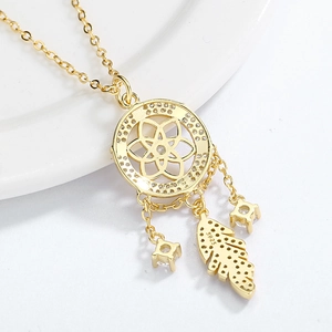 Macro shot of S925 silver dreamcatcher pendant showing leaf detail and stone setting