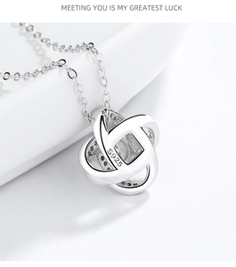 Close-up of S925 sterling silver four-leaf clover pendant with sparkling zircon inlay