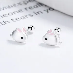 Detail of S925 silver rabbit stud earring with matte finish and pink enamel decor