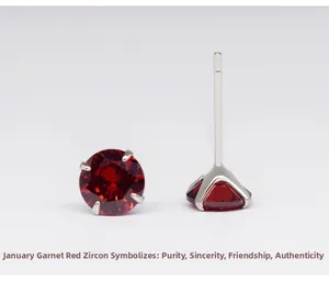 Detailed view of 925 silver stud earrings featuring four-prong garnet red cubic zirconia