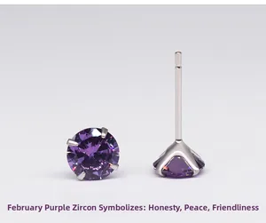 Close-up of February birthstone earrings with purple zircon in a four-prong silver setting